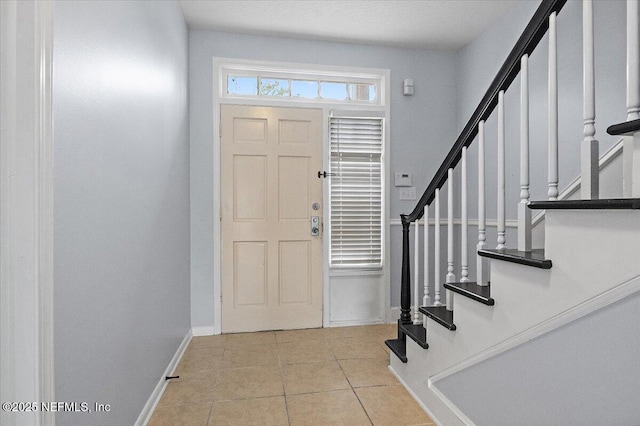 view of tiled foyer entrance