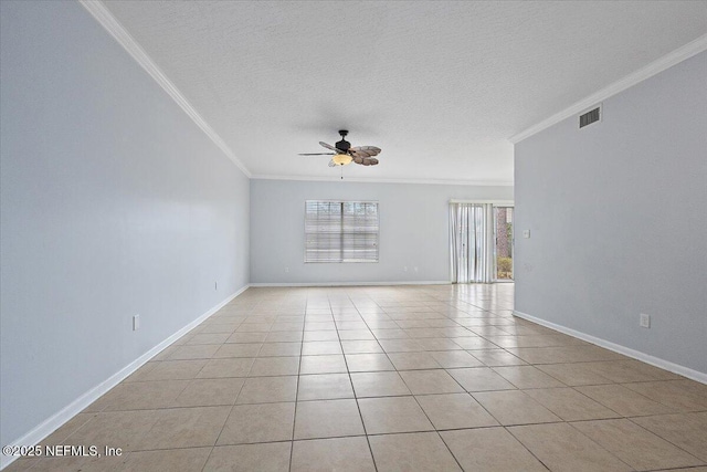 tiled spare room with ornamental molding, a textured ceiling, and ceiling fan