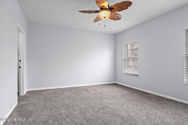 unfurnished room with carpet floors and ceiling fan