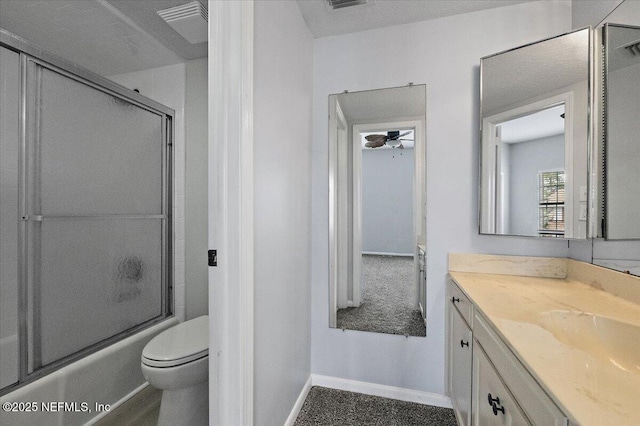 full bathroom featuring vanity, enclosed tub / shower combo, and toilet