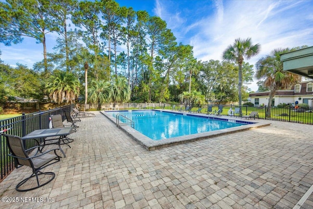 view of swimming pool with a patio