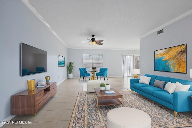 tiled living room with ornamental molding and ceiling fan