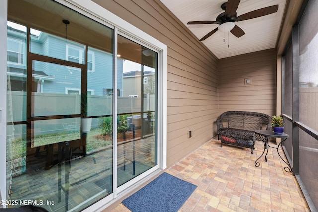 sunroom / solarium with ceiling fan