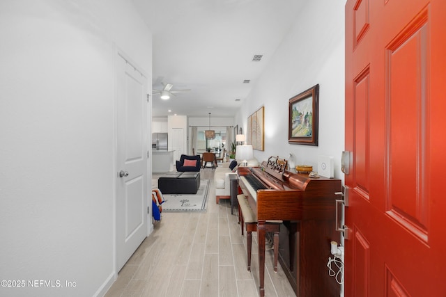 corridor featuring light wood-type flooring