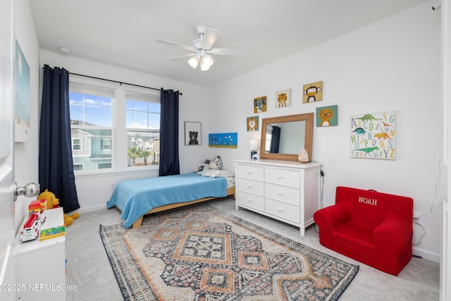 carpeted bedroom with ceiling fan