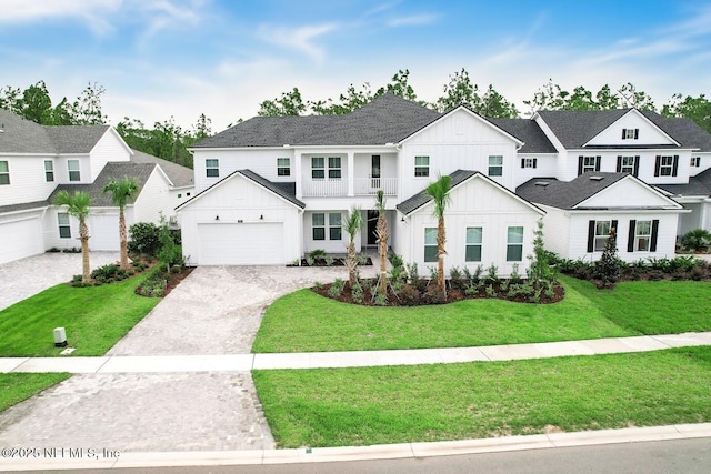 modern farmhouse style home featuring a garage and a front lawn