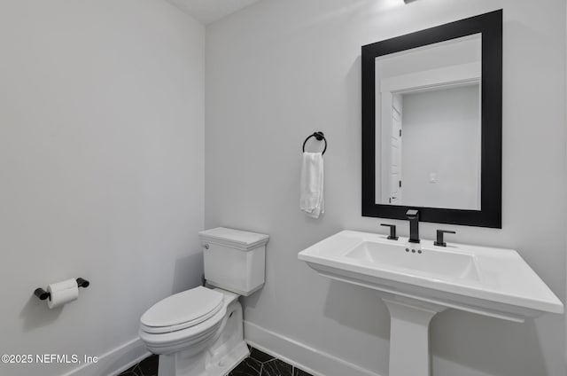 bathroom featuring toilet