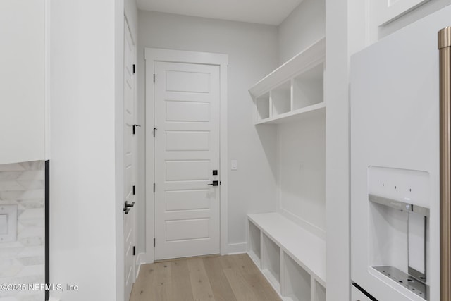 mudroom with light hardwood / wood-style floors