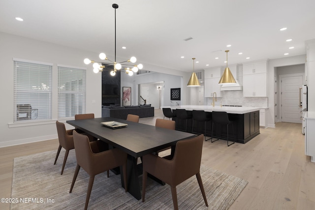 dining area featuring light wood-type flooring