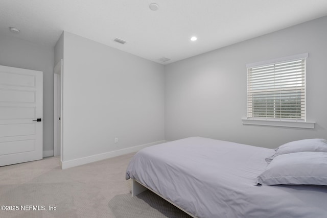 bedroom featuring light colored carpet