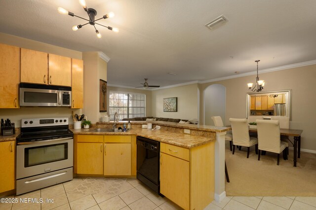 kitchen with appliances with stainless steel finishes, light brown cabinetry, kitchen peninsula, and sink