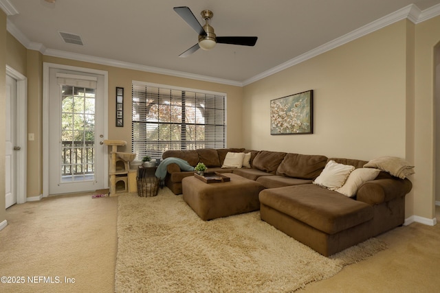 living room featuring crown molding and carpet