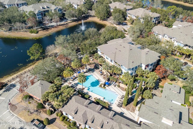 birds eye view of property featuring a water view