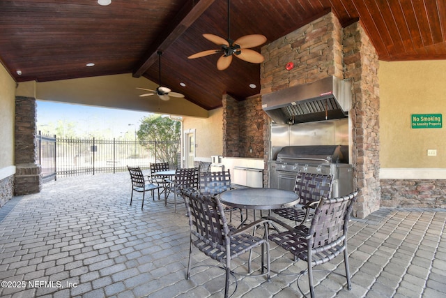 view of patio with ceiling fan and exterior kitchen