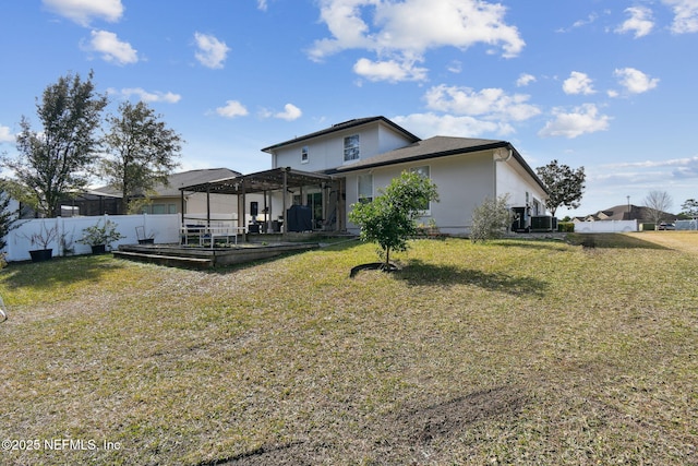 rear view of property with central AC, a pergola, and a lawn