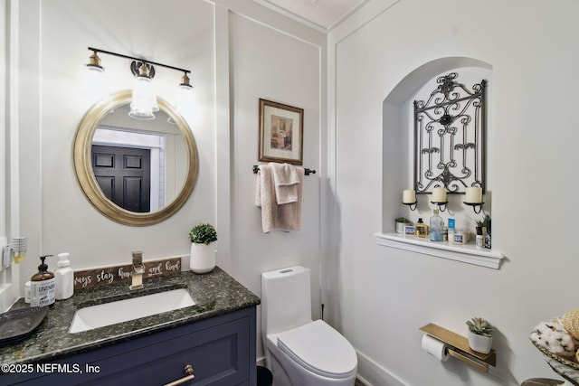 bathroom with vanity and toilet