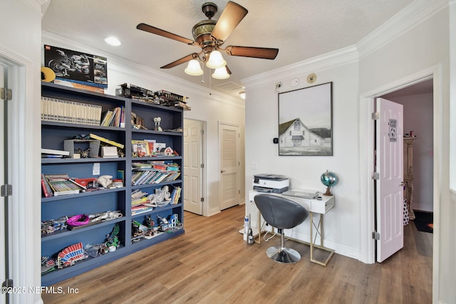 office area with ceiling fan, ornamental molding, and hardwood / wood-style floors