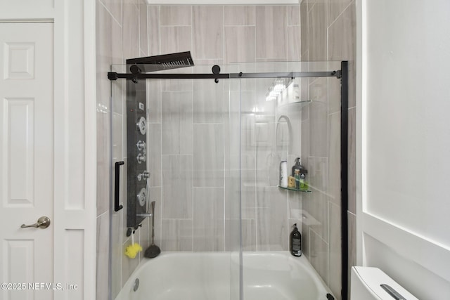 bathroom with enclosed tub / shower combo and toilet