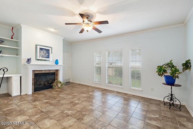 living room with ceiling fan, ornamental molding, a fireplace, and a textured ceiling