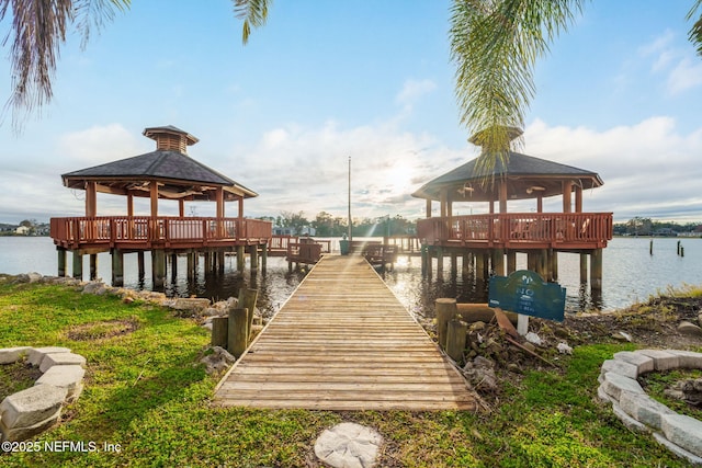 view of dock featuring a gazebo and a water view