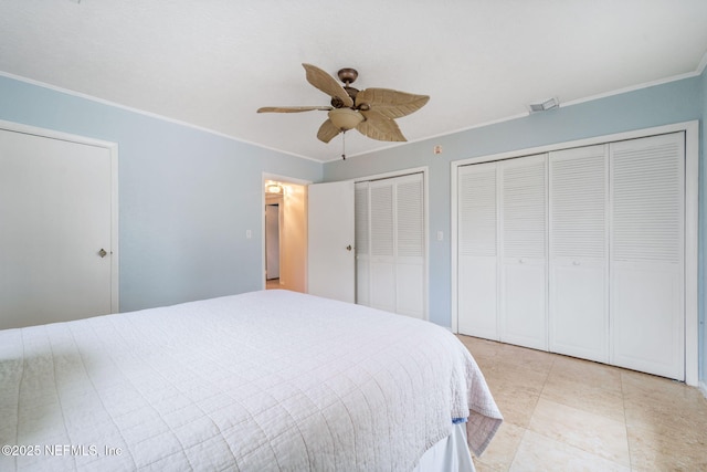 bedroom with multiple closets, crown molding, and ceiling fan