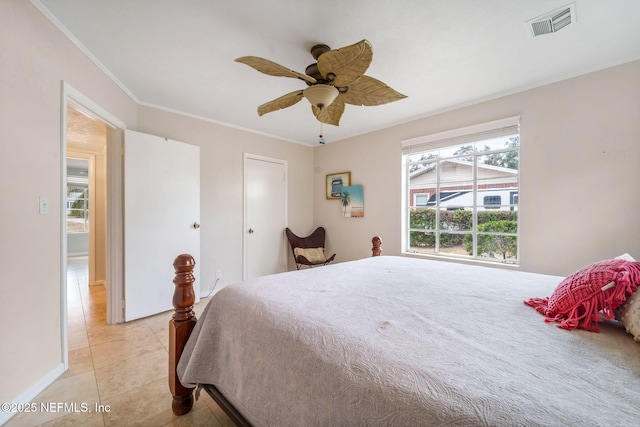 tiled bedroom with ceiling fan