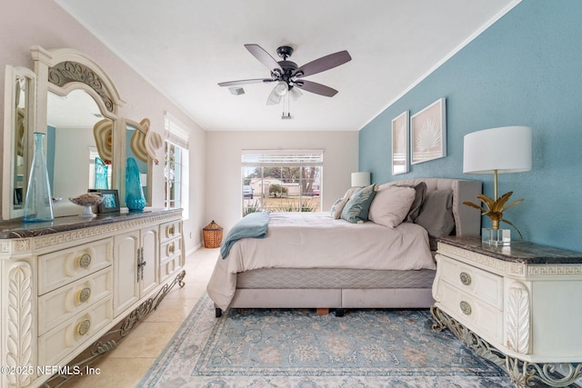 bedroom with light tile patterned floors and ceiling fan