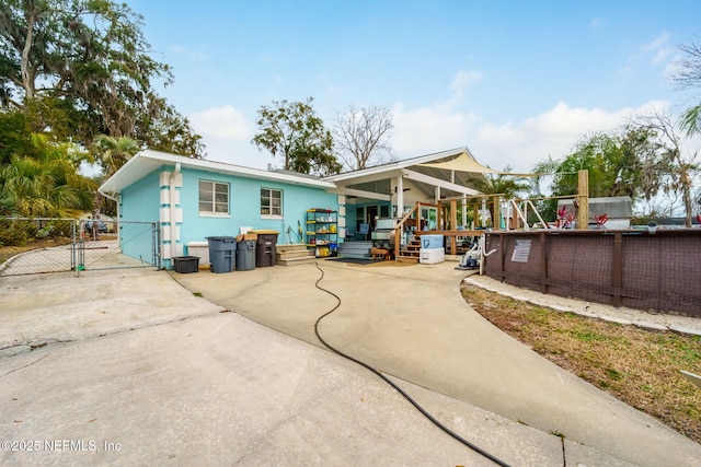 back of property with covered porch