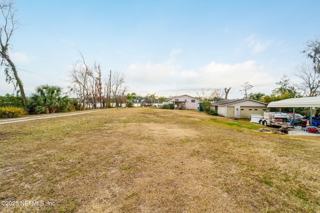 view of yard with a carport