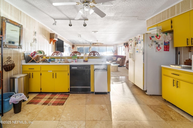 kitchen featuring sink, black dishwasher, white fridge with ice dispenser, a textured ceiling, and kitchen peninsula