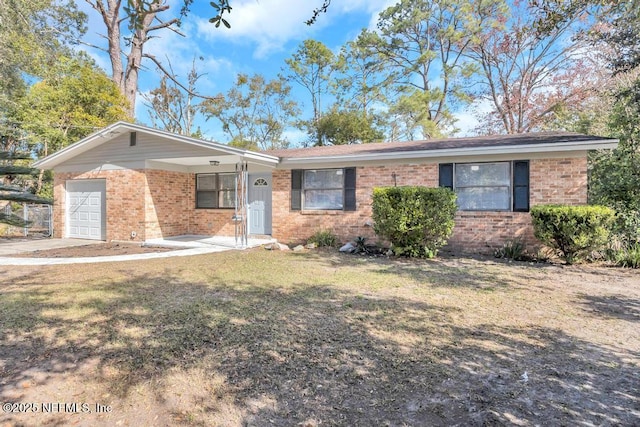 single story home featuring a garage and a front lawn