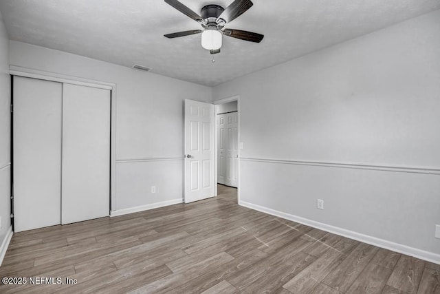 unfurnished bedroom with ceiling fan