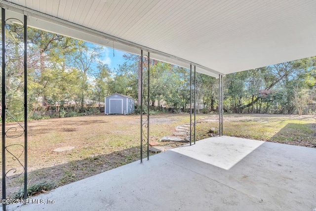 view of patio / terrace featuring a storage unit