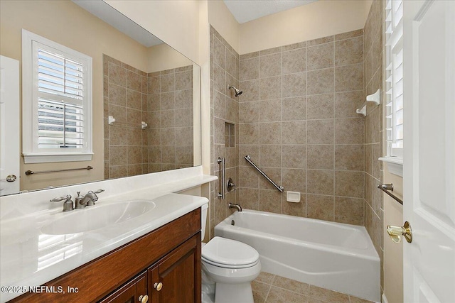 full bath featuring vanity, bathing tub / shower combination, toilet, and tile patterned floors