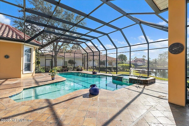 view of pool with a patio, a pool with connected hot tub, and a lanai