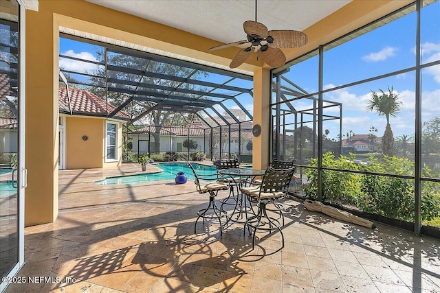 sunroom with a swimming pool