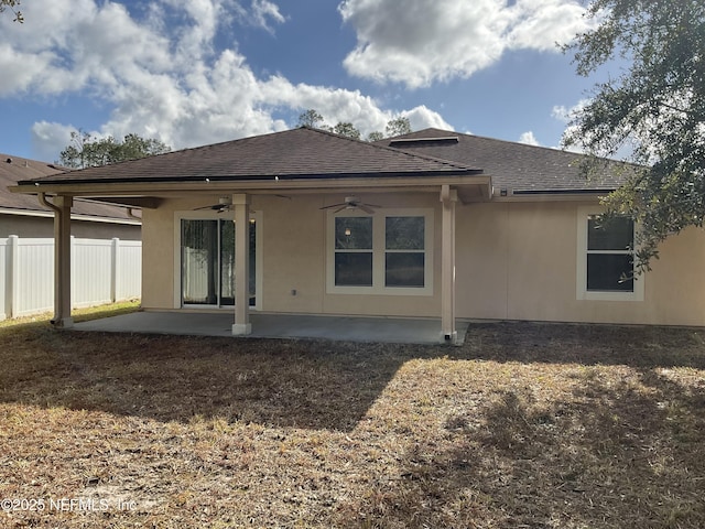 rear view of property with ceiling fan and a patio