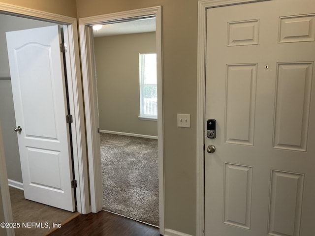 interior space featuring dark carpet