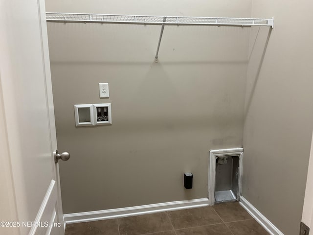 washroom with washer hookup, hookup for an electric dryer, and dark tile patterned flooring