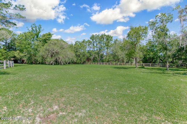 view of yard with a rural view