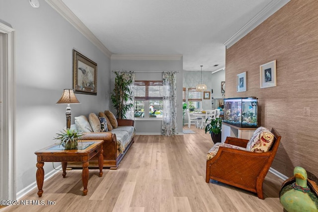 living area featuring ornamental molding and light hardwood / wood-style flooring