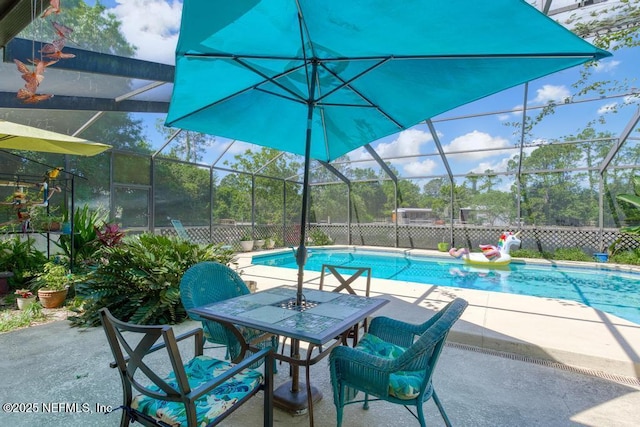 view of pool with a lanai and a patio area