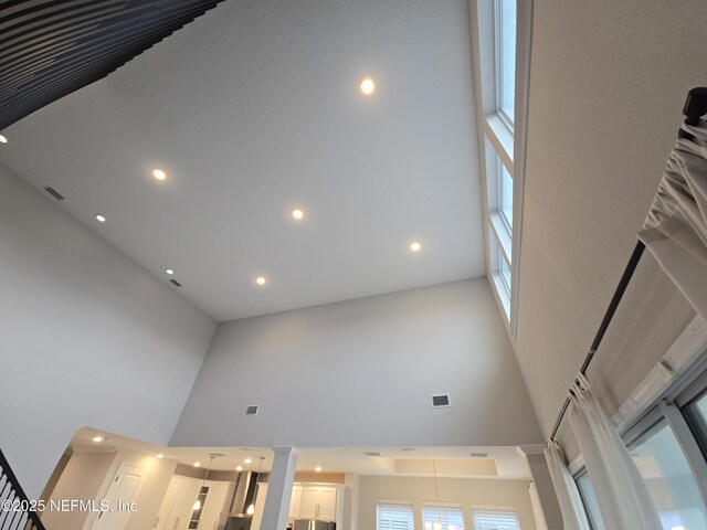 room details featuring recessed lighting, visible vents, and decorative columns