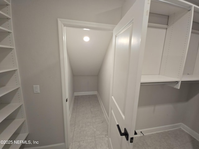 spacious closet featuring light tile patterned floors