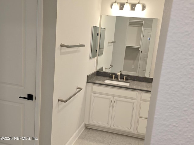 bathroom featuring tile patterned flooring and vanity