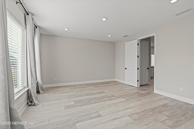 unfurnished room featuring light wood-type flooring