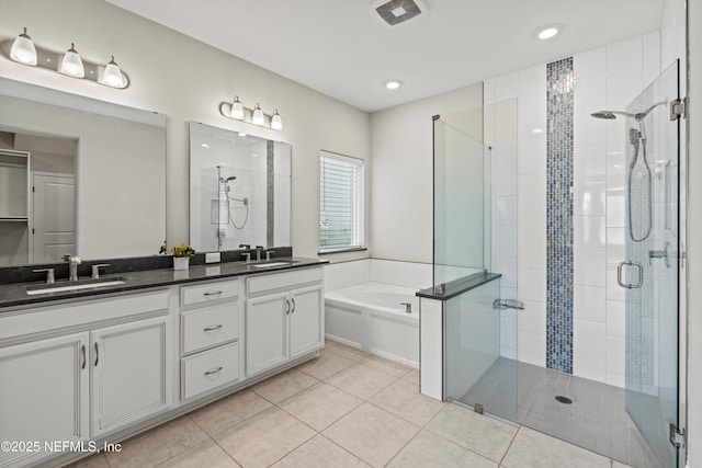 bathroom with vanity, tile patterned flooring, and shower with separate bathtub