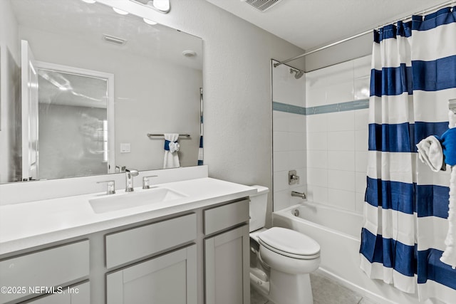 full bathroom with shower / bathtub combination with curtain, visible vents, toilet, vanity, and a textured wall