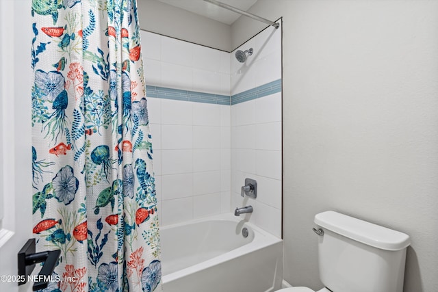 bathroom featuring shower / bathtub combination with curtain and toilet