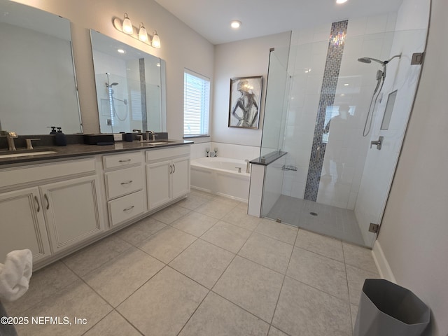 bathroom with a sink, tiled shower, and a garden tub